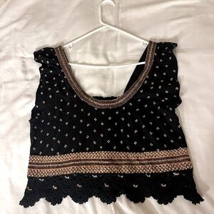 Free people black top with tan knit embroidery. SIZE M